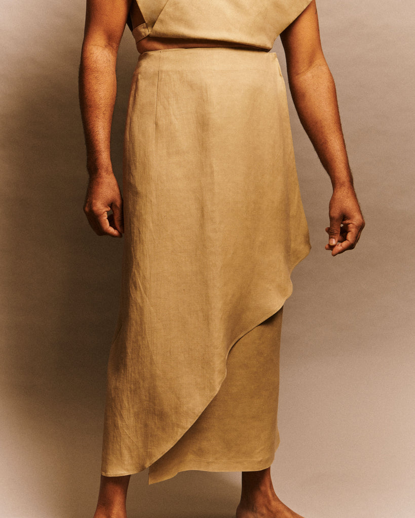 Men and women asymmetrical wrap skirt in beige linen deadstock fabric with mother-of-pearl buttons model Odette LES DUNES