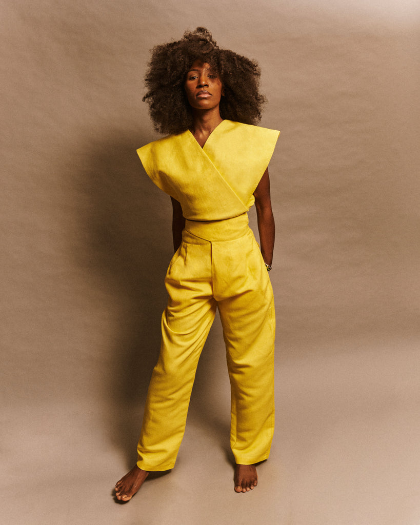 Men and women high waist double-breasted pants with dune-shaped back pockets in yellow linen deadstock fabric with mother-of-pearl buttons model Jean-Paul LES DUNES.